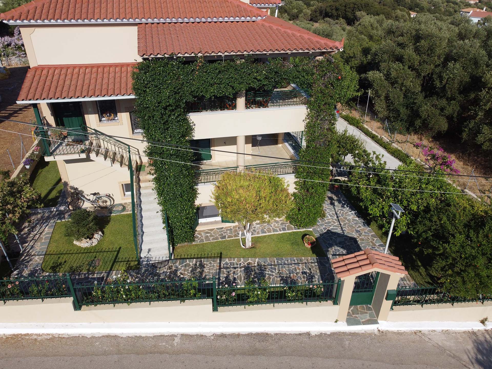 Aerial view of Strelitzia Apartments and garden in Karavados, Kefalonia