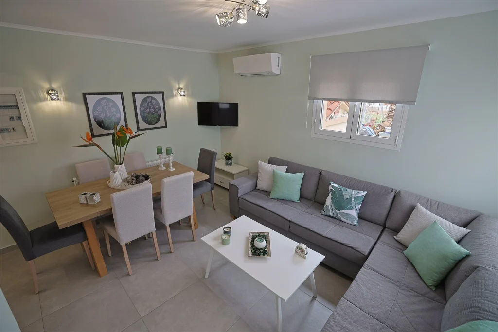 Living and dining area at Strelitzia Apartment in Karavados, Kefalonia